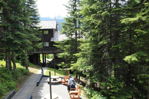 a resort with tables and chairs in the woods at Crystal Chalets in Greenwater