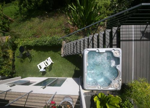 a tv sitting on the ground in a yard at Ocean view & spa in Punaauia