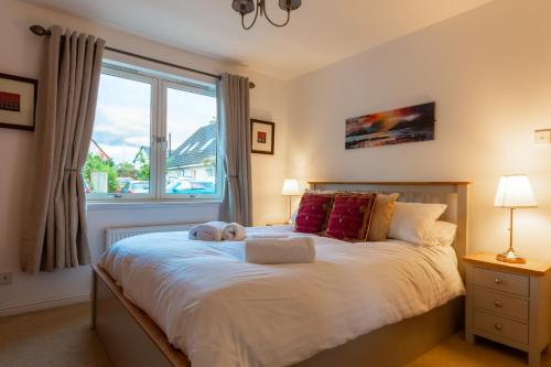 Ένα ή περισσότερα κρεβάτια σε δωμάτιο στο Tigh na Lochan