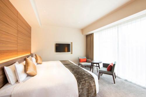 Postel nebo postele na pokoji v ubytování karaksa hotel premier Tokyo Ginza