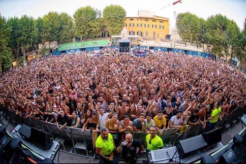 a large crowd of people sitting in an auditorium at Piazza Napoleone Sweet apartment in Lucca