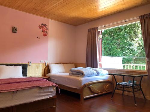 Ένα ή περισσότερα κρεβάτια σε δωμάτιο στο Chingjing ‧ orange Scotia
