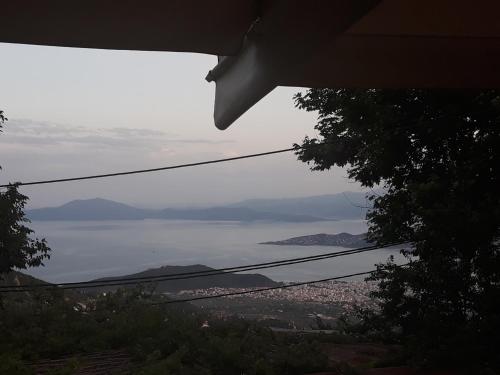 a view of a city and a body of water at Mansion Theodora in Makrinítsa