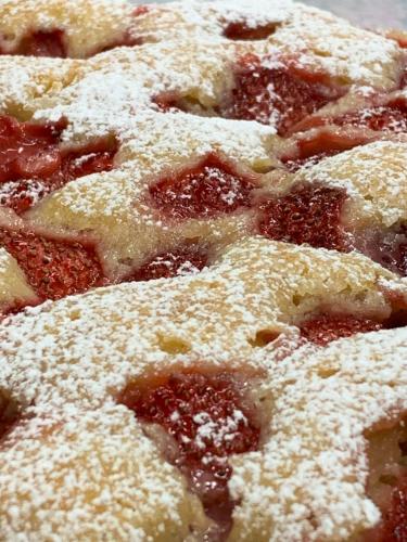 a close up of a pizza with powdered sugar on it at B&B Beauty House in Cesena