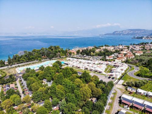 an aerial view of a resort next to the ocean at Sisan Family Resort in Bardolino