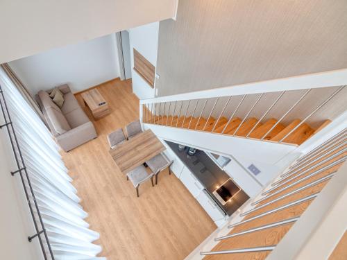 an overhead view of a living room with a staircase at WESTSIDE Hotel in Munich