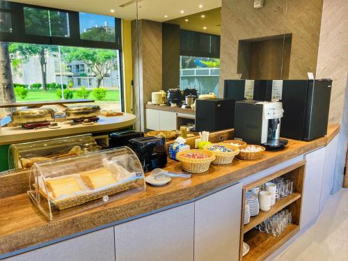 a kitchen with a counter with food on it at Harport Motel in Niaosong