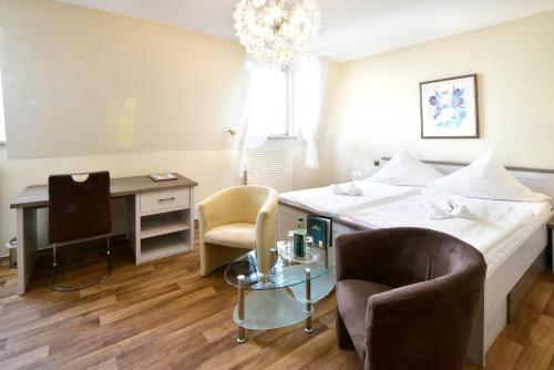 Postel nebo postele na pokoji v ubytování Hotel Alexandra