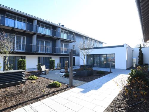 an exterior view of a building with a courtyard at WESTSIDE Hotel in Munich