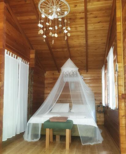 a bedroom with a bed with a mosquito net at Portalimo Lodge Hotel - Adult Only +12 in Cıralı