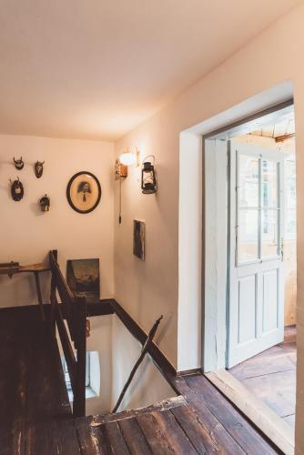 a room with a staircase with a door and a window at Chalet am Sonnenhang in Obertraun
