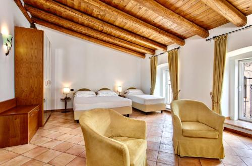 En eller flere senge i et værelse på Residence San Giusto