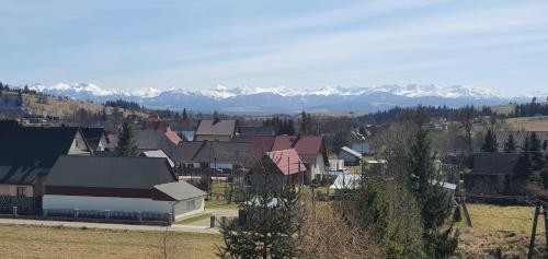 a small town with mountains in the background at Nocleg U Jagódki in Zubrzyca Dolna