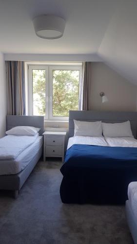 Postel nebo postele na pokoji v ubytování U Kierownika Plaży