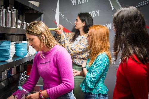 a group of women standing in a store at Sheilas Tourist Hostel in Cork