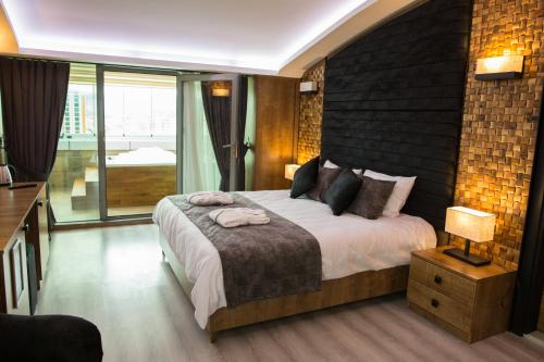 En eller flere senge i et værelse på Hotel BFC Spa & Sport