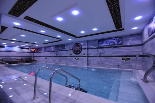 a large swimming pool in a building at Hotel BFC Spa & Sport in Bursa