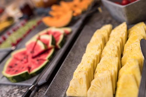 a bunch of food with fruit on a table at Hotel Patriarch in Tirolo