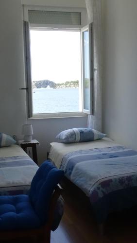 Katil atau katil-katil dalam bilik di Apartmani Rina