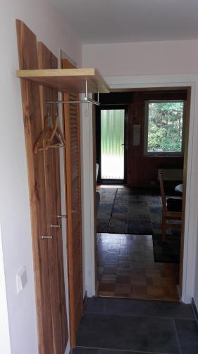 a door leading into a room with a hallway at Finnhaus Neubauer in Elbingerode