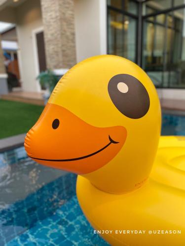 a yellow rubber duck in a swimming pool at Uzeason Poolvilla Sattahip in Sattahip