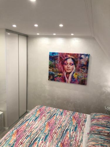 a painting of a woman hanging on a wall at Apartment Vid in Split