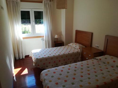 Posteľ alebo postele v izbe v ubytovaní Apartamento Residencial Illa de Ons