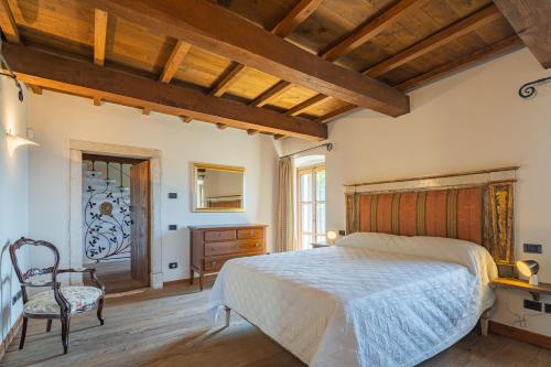 Tempat tidur dalam kamar di Convento La Perla