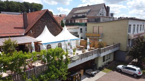 an overhead view of a building with a white tent at Landhotel Engel in Limbach