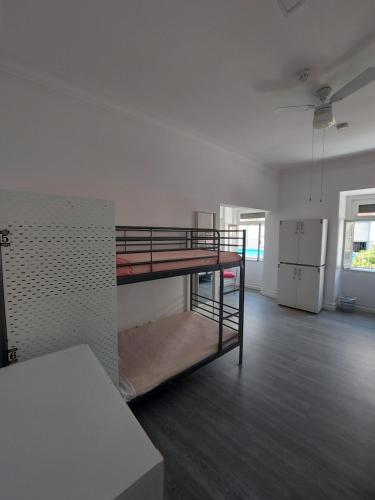 a room with a bunk bed in a room at Aloha Hostel in Portimão