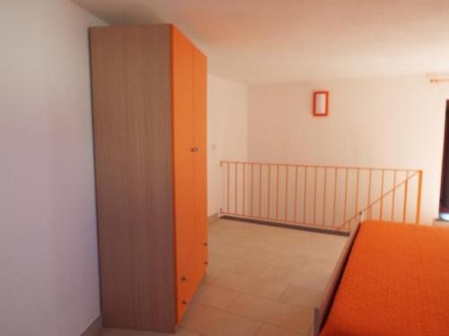 Postel nebo postele na pokoji v ubytování ANFORA Arancione