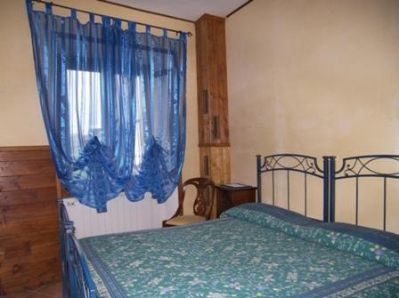 Ein Bett oder Betten in einem Zimmer der Unterkunft Osteria dei Tratturi Rooms