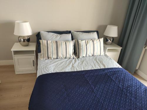 Katil atau katil-katil dalam bilik di Masuria Apartaments Ełk Nadjeziorna