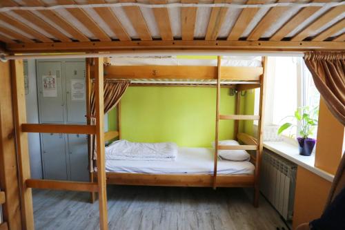 Una cama o camas en una habitación de Light Life Hostel