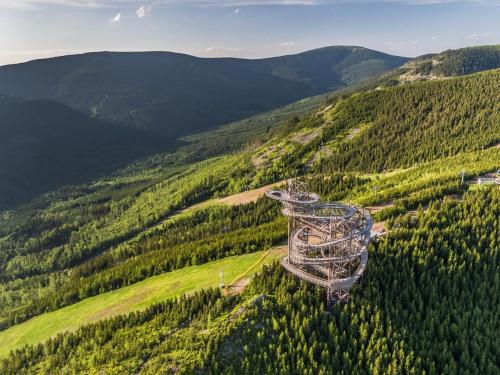 an aerial view of a ski lift in the mountains at Apartmány Pod Sjezdovkou in Červená Voda