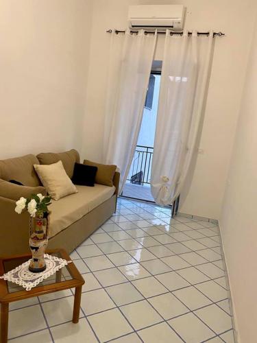 a living room with a couch and a table at casa vacanza cilento PARDALIS in Agropoli