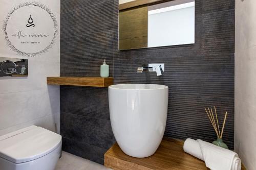 a bathroom with a sink and a toilet at V5 Villa Emma - Luxury 5 bedroom villa in Alvor with private Pool and Jacuzzi in Alvor