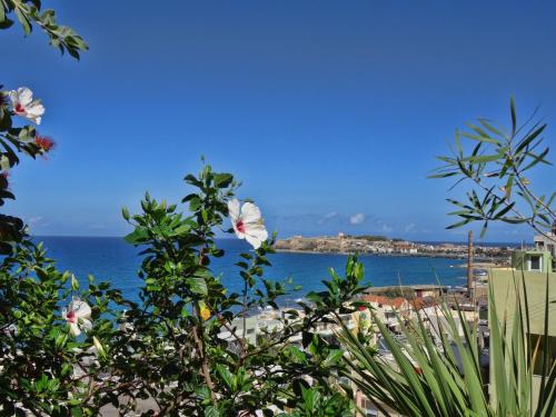 a view of the ocean from the beach at Eliza Apartments in Rethymno Town