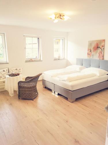 a large bedroom with a bed and a table at Landidyll am Thiersee in Thiersee