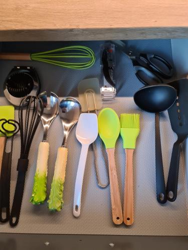a drawer filled with lots of utensils at Aurora Dream in Svensby