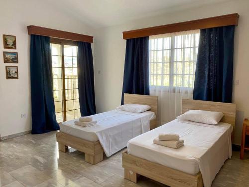 Кровать или кровати в номере Villa Kapistris Dyo