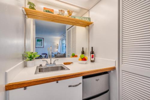 a kitchen with a sink and a mirror at @ Marbella Lane - Breezy Studio@Diamond Head Beach Hotel in Honolulu