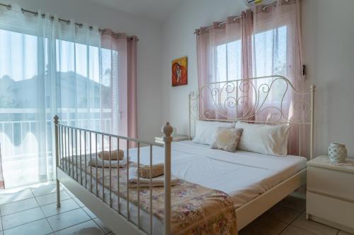 Postel nebo postele na pokoji v ubytování Sun & Sand Private Villa