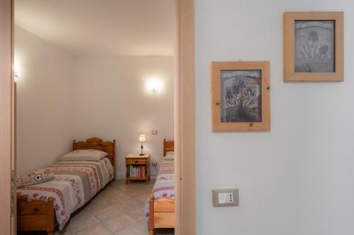 Posteľ alebo postele v izbe v ubytovaní La Piccola Casa Verde