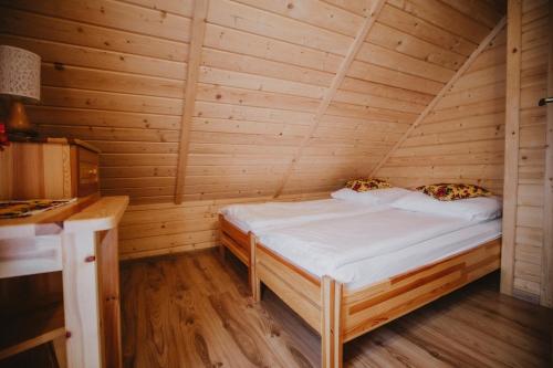 Postel nebo postele na pokoji v ubytování Domki i Pokoje obok Term Chochołów U Tadka