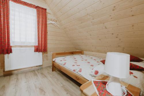 Postel nebo postele na pokoji v ubytování Domki i Pokoje obok Term Chochołów U Tadka