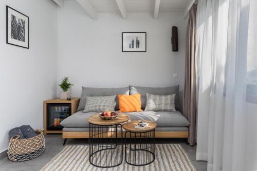 a living room with a couch and a table at Kamares Sanctuaries in Kolymvari