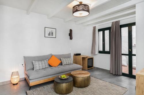 a living room with a couch and a table at Kamares Sanctuaries in Kolymvari