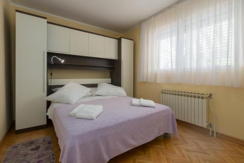 Postel nebo postele na pokoji v ubytování Vila Renata