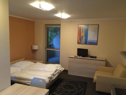 Postel nebo postele na pokoji v ubytování Apartman Harrachov